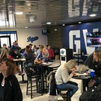 tables and people in fieldhouse